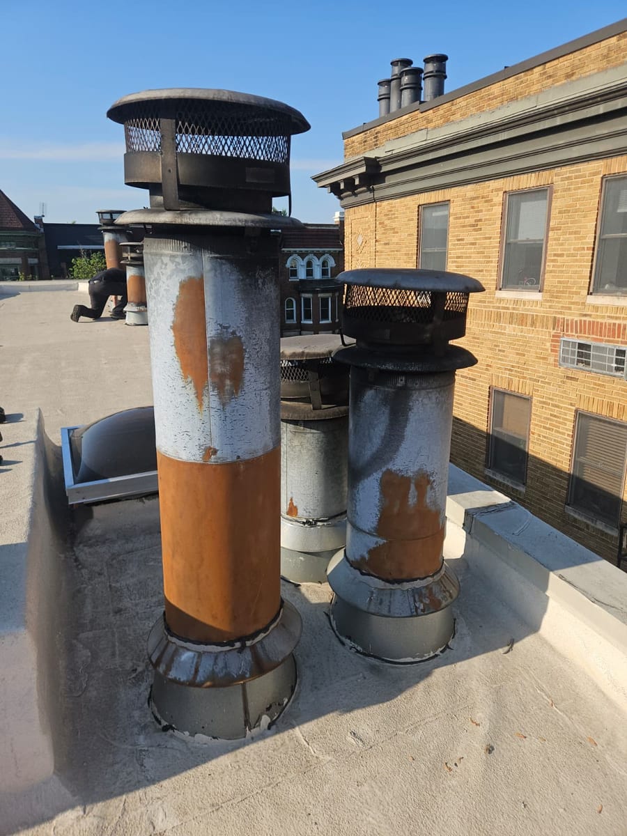 Rusted chimney cap identified during ChimmerJim inspection